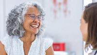 Smiling older woman at a medical appointment.